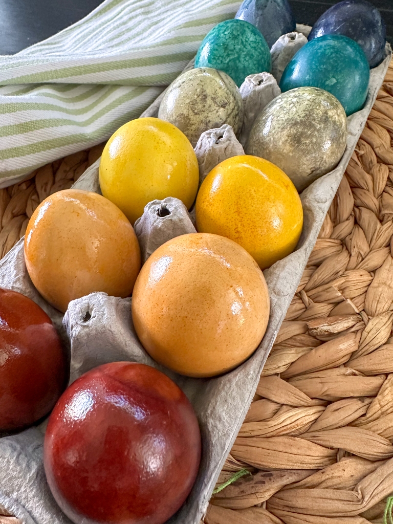 egg carton with Easter eggs dyed using natural materials