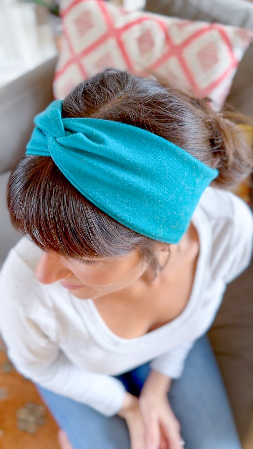 Beautiful woman modeling DIY Stretchy Twisted Headband vertical view